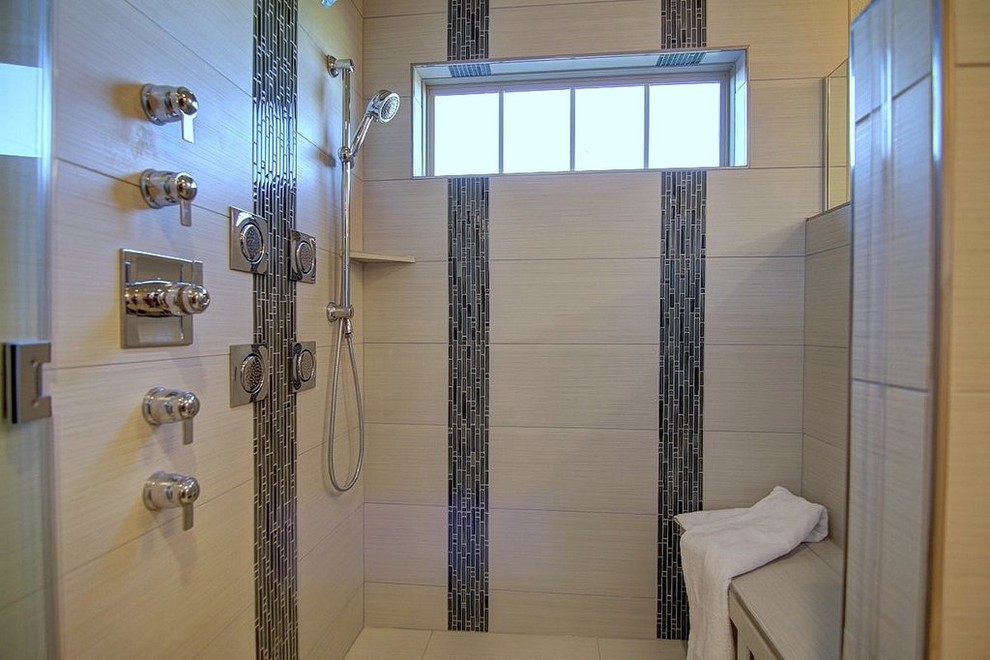 Inspiration for a mid-sized timeless master beige tile corner shower remodel in Milwaukee