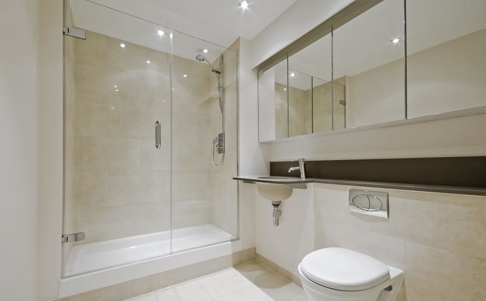 Alcove shower - mid-sized contemporary 3/4 beige tile and porcelain tile porcelain tile alcove shower idea in Other with a bidet, beige walls, an undermount sink and solid surface countertops