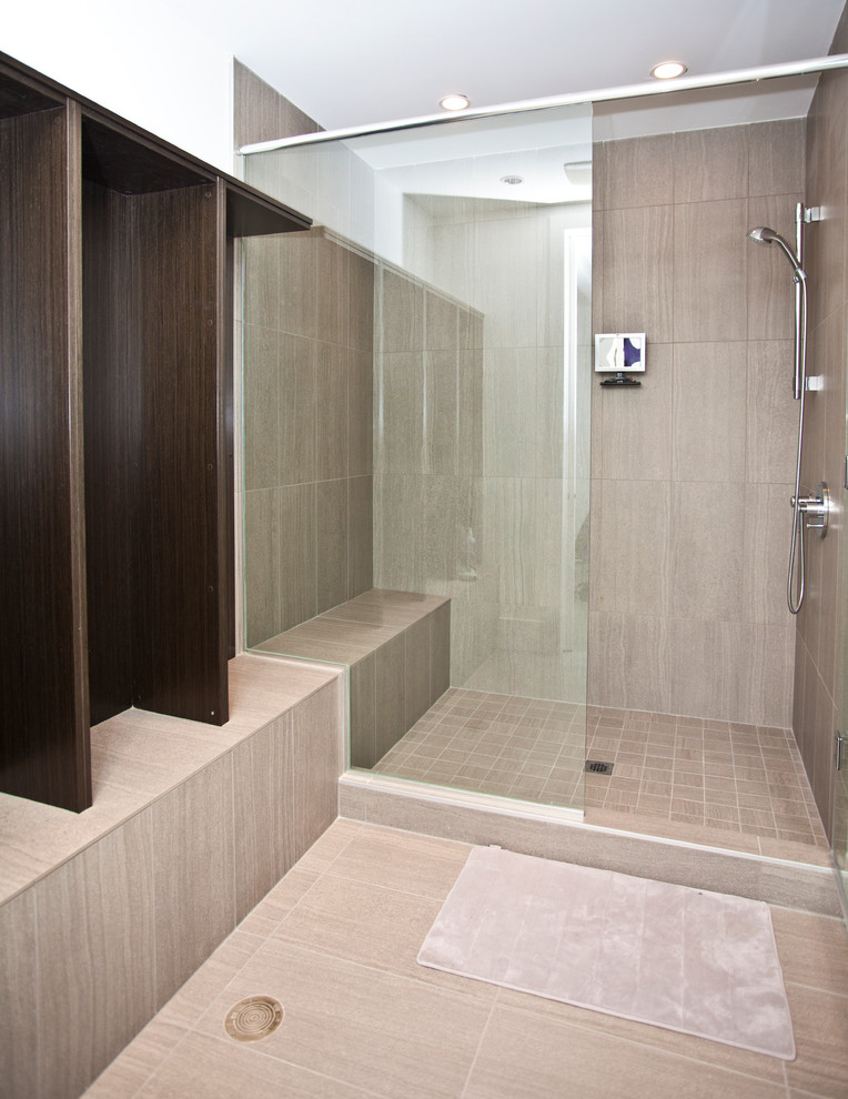 This is an example of a modern bathroom in Vancouver with a submerged sink, flat-panel cabinets, dark wood cabinets, engineered stone worktops, a walk-in shower, a wall mounted toilet, grey tiles, stone tiles, white walls and mosaic tile flooring.