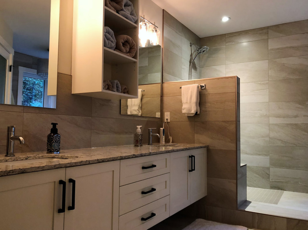 Photo of a medium sized classic ensuite bathroom in Other with shaker cabinets, yellow cabinets, a walk-in shower, beige tiles, porcelain tiles, a submerged sink, quartz worktops, multi-coloured worktops, double sinks and a floating vanity unit.