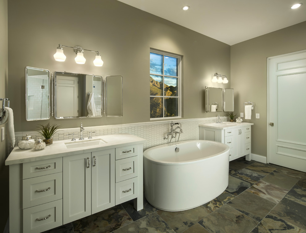 Bathroom - transitional bathroom idea in Phoenix with white cabinets and marble countertops