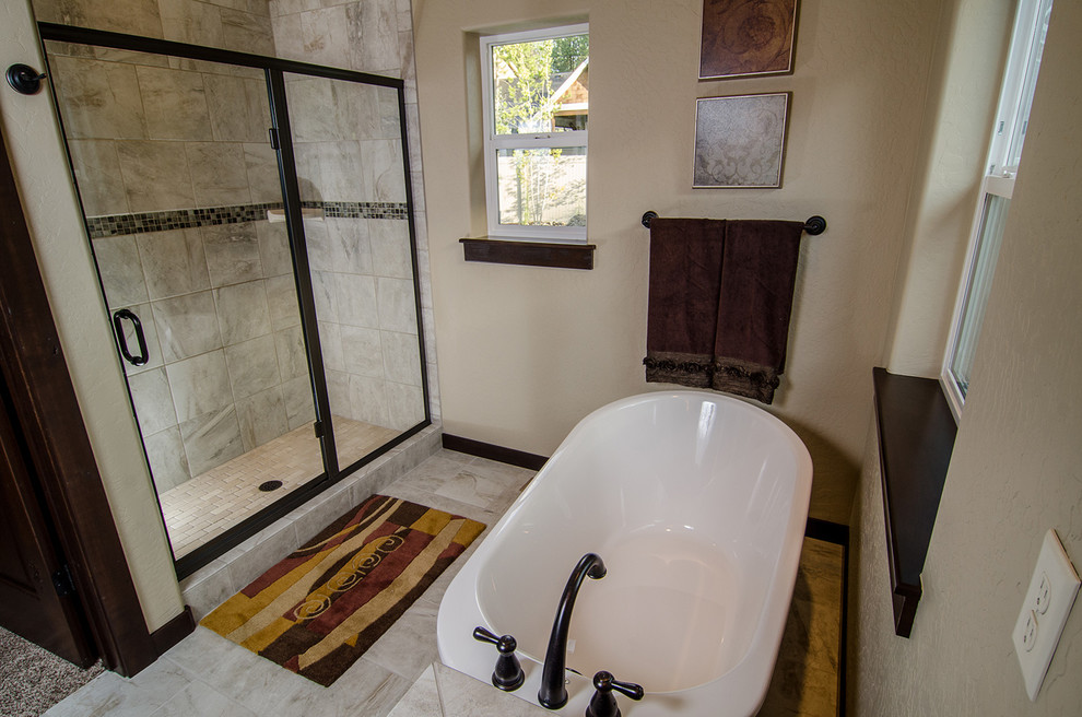 Inspiration for a mid-sized craftsman master beige tile and ceramic tile ceramic tile bathroom remodel in Seattle with a vessel sink, recessed-panel cabinets, dark wood cabinets, a two-piece toilet and beige walls