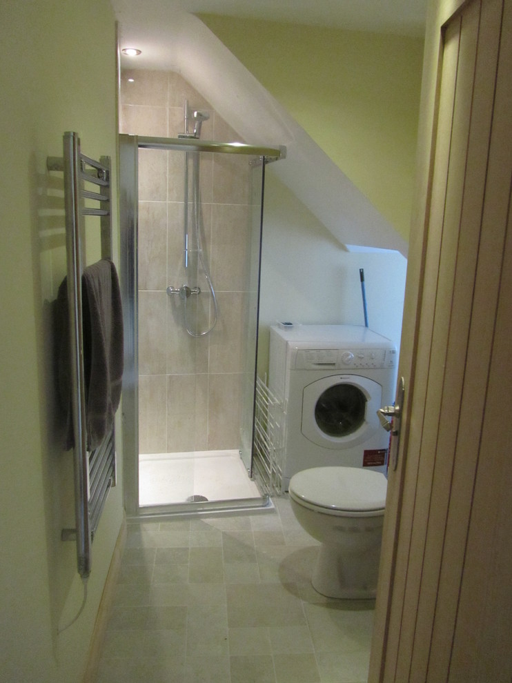 This is an example of a small contemporary bathroom in Other with beige walls and travertine flooring.
