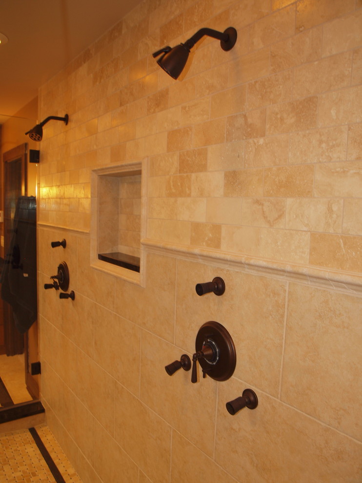 Double shower - large traditional master beige tile double shower idea in Chicago with beige walls
