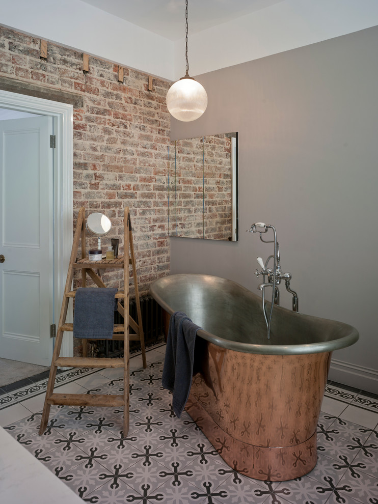 This is an example of a bohemian bathroom in Sussex with a built-in sink and solid surface worktops.