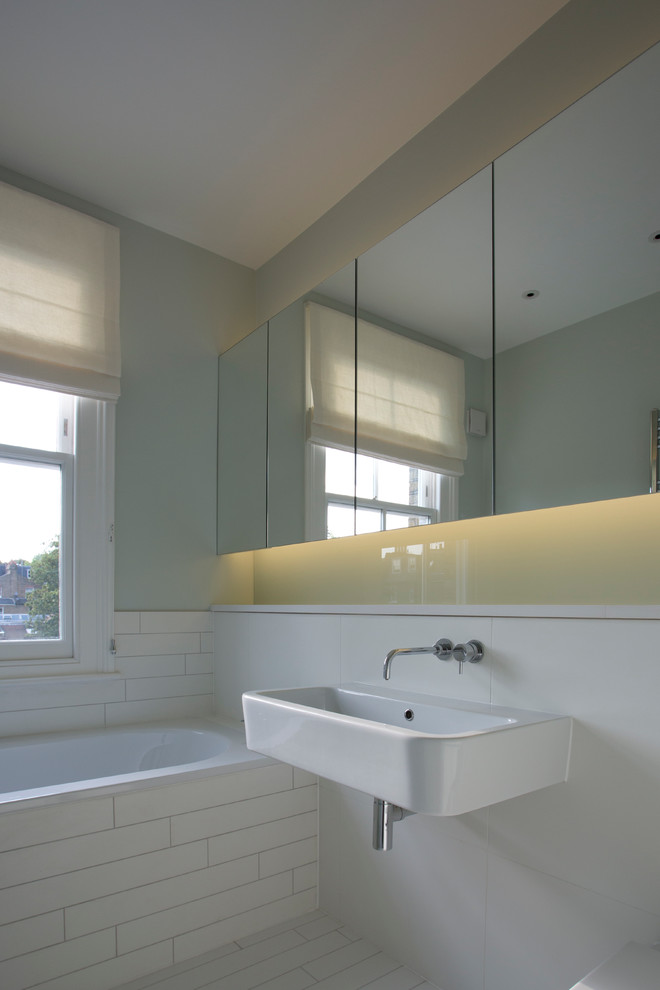 Contemporary bathroom in Sussex with a built-in sink and solid surface worktops.