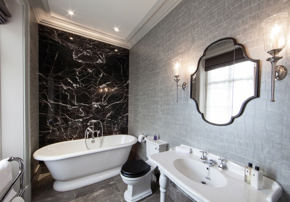 Freestanding bathtub - contemporary marble tile freestanding bathtub idea in Manchester