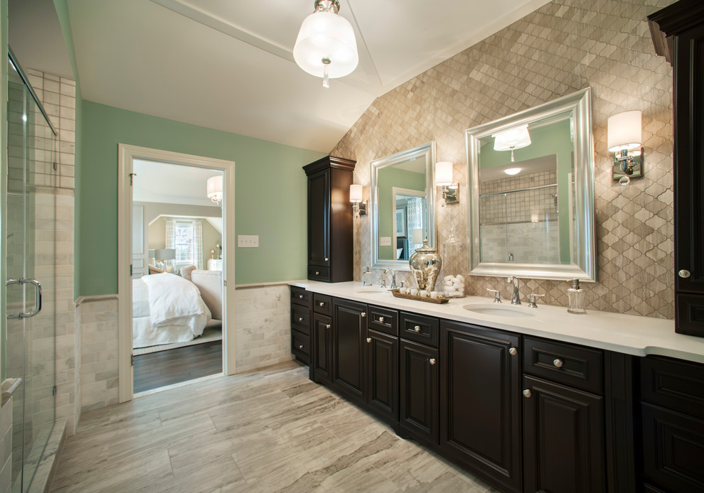 Bathroom - mid-sized transitional master beige tile and porcelain tile light wood floor bathroom idea in Philadelphia with recessed-panel cabinets, black cabinets, an undermount sink and quartz countertops