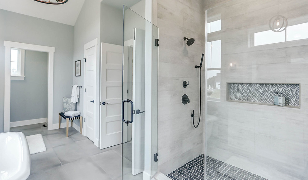 Large farmhouse master gray tile ceramic tile and gray floor bathroom photo in Other with white cabinets, a one-piece toilet, blue walls, an undermount sink, quartz countertops, a hinged shower door and beige countertops