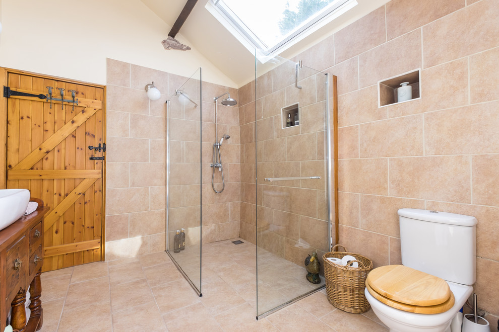 Design ideas for a large rustic shower room bathroom in Other with medium wood cabinets, beige tiles, ceramic tiles, beige walls, a vessel sink, wooden worktops, a built-in shower, a two-piece toilet, brown worktops and flat-panel cabinets.