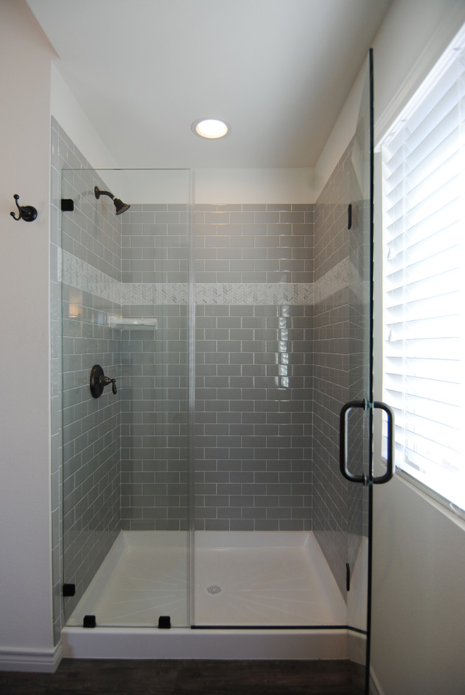 Inspiration for a large cottage master gray tile and subway tile vinyl floor bathroom remodel in Austin with raised-panel cabinets, green cabinets, a two-piece toilet, white walls, a drop-in sink and laminate countertops