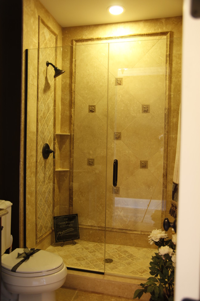 Example of a mid-sized classic 3/4 brown tile and mosaic tile ceramic tile alcove shower design in Chicago with raised-panel cabinets, medium tone wood cabinets, a two-piece toilet, yellow walls, a drop-in sink and granite countertops
