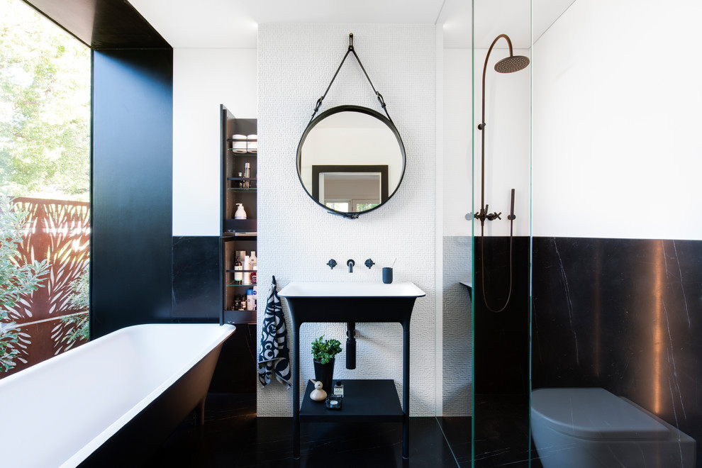 Inspiration for a small modern master white tile and marble tile marble floor and black floor bathroom remodel in Sydney with flat-panel cabinets, black cabinets, a wall-mount toilet, white walls and a pedestal sink
