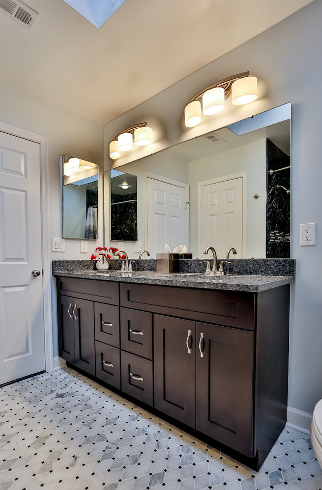 Bathroom - small traditional black tile and porcelain tile marble floor and gray floor bathroom idea in DC Metro with shaker cabinets, dark wood cabinets, gray walls, granite countertops and an undermount sink
