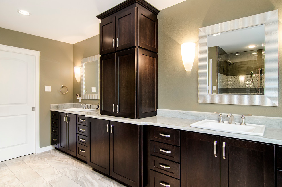 Example of a mid-sized classic master beige tile and porcelain tile light wood floor bathroom design in Dallas with a drop-in sink, shaker cabinets, dark wood cabinets, quartzite countertops, a two-piece toilet and green walls