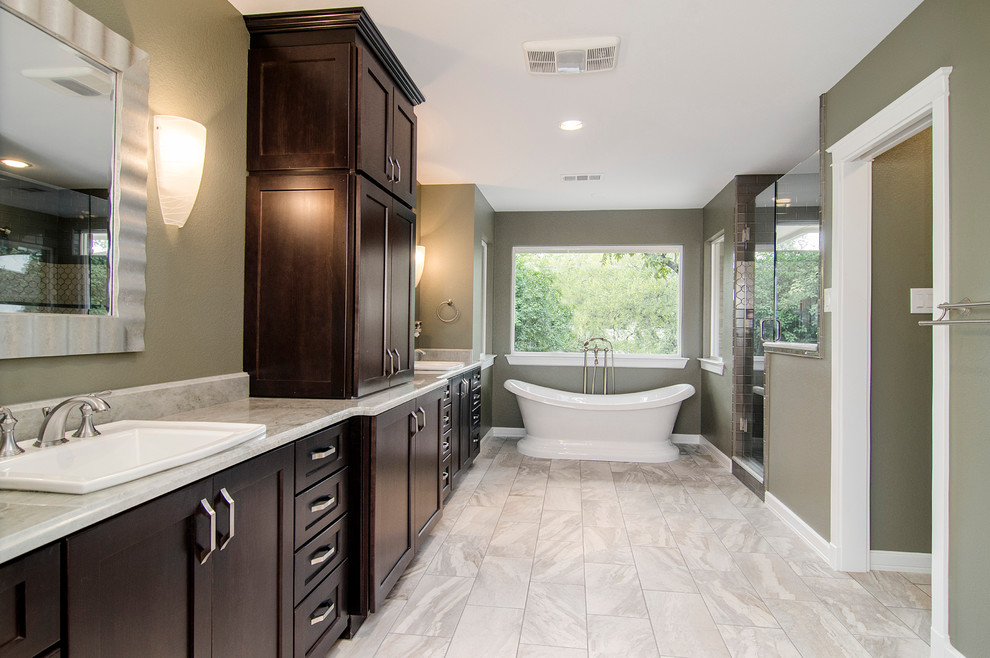 Inspiration for a mid-sized timeless master beige tile and porcelain tile light wood floor bathroom remodel in Dallas with a drop-in sink, shaker cabinets, dark wood cabinets, quartzite countertops, a two-piece toilet and green walls