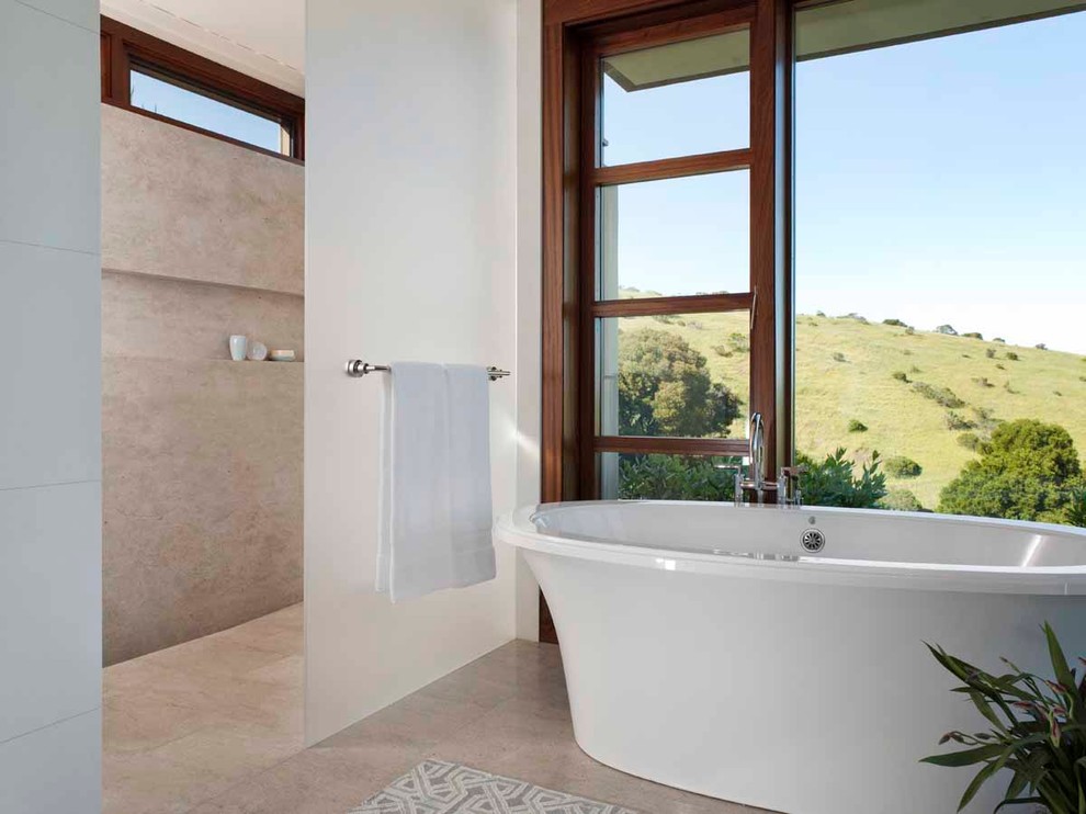 This is an example of a contemporary bathroom in San Francisco with a freestanding bath.