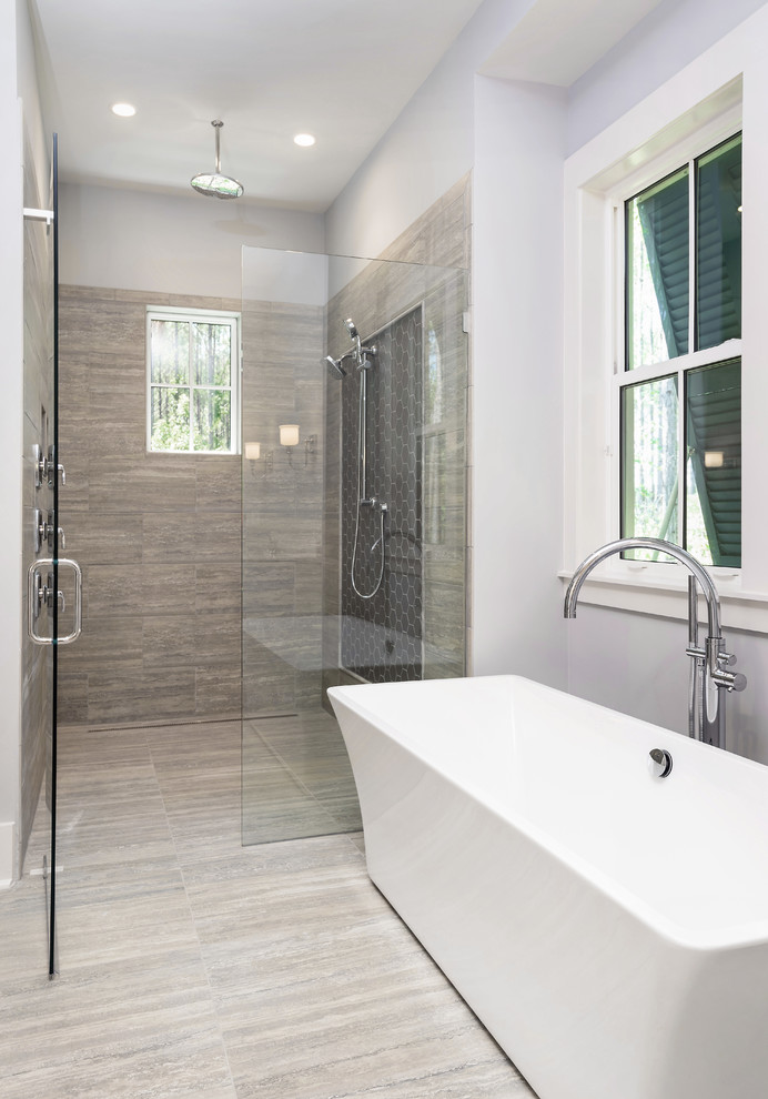 Design ideas for a large classic ensuite bathroom in Jacksonville with recessed-panel cabinets, white cabinets, a freestanding bath, a built-in shower, grey tiles, porcelain tiles, grey walls, porcelain flooring, a submerged sink, quartz worktops, grey floors and a hinged door.