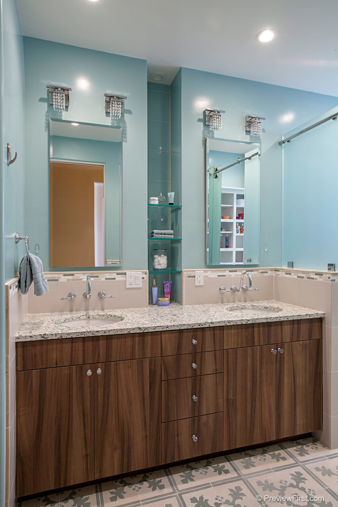 На фото: детская ванная комната среднего размера в современном стиле с врезной раковиной, плоскими фасадами, темными деревянными фасадами, столешницей из переработанного стекла, инсталляцией, синей плиткой, керамической плиткой, синими стенами и полом из керамической плитки с