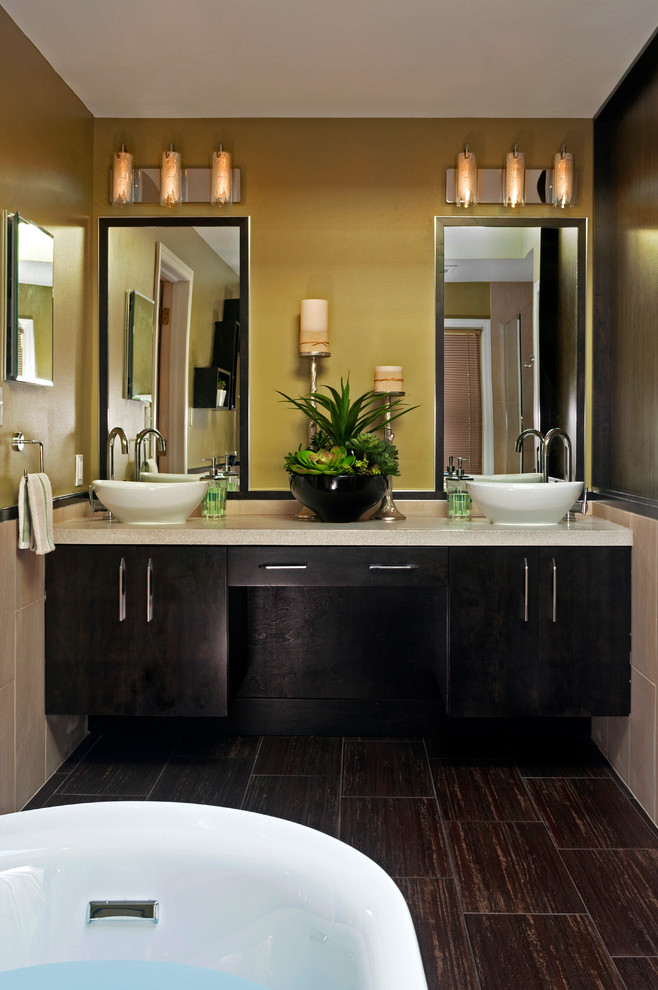 Example of a mid-sized minimalist brown tile and porcelain tile freestanding bathtub design in Other with a vessel sink, flat-panel cabinets, dark wood cabinets and concrete countertops