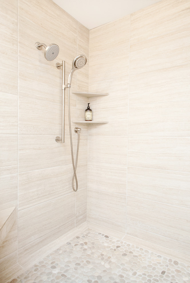 Corner shower - mid-sized contemporary master beige tile and porcelain tile pebble tile floor corner shower idea in Portland with recessed-panel cabinets, dark wood cabinets, a two-piece toilet, gray walls, a vessel sink and quartz countertops