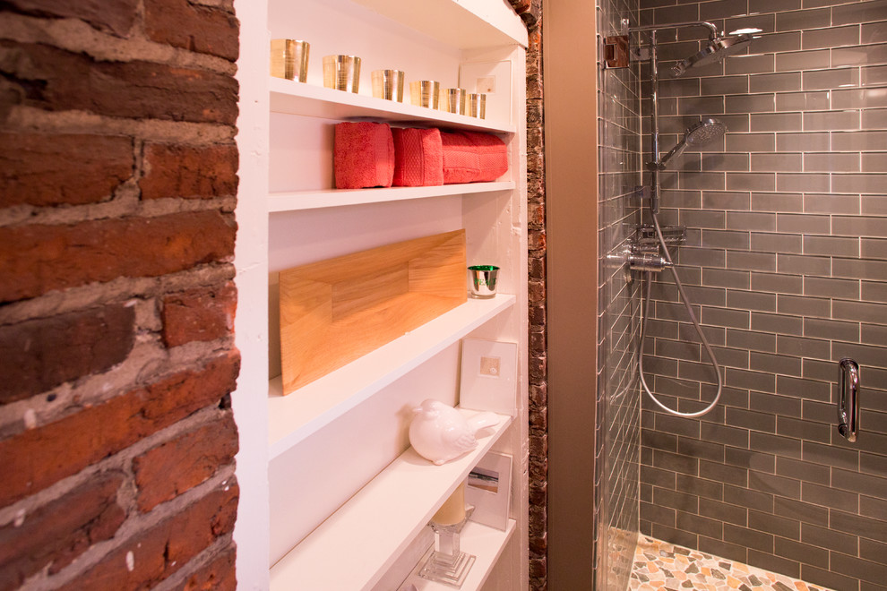 This is an example of a medium sized eclectic bathroom in New York with raised-panel cabinets, dark wood cabinets, grey tiles, metro tiles, beige walls, mosaic tile flooring, a submerged sink and granite worktops.