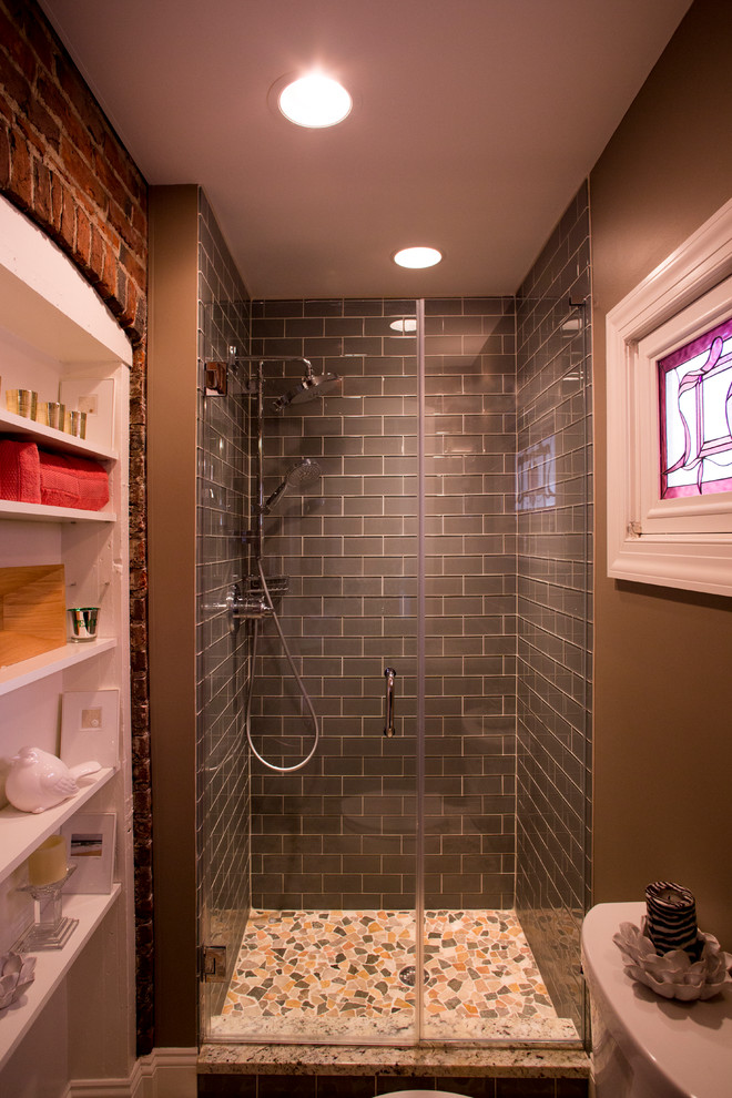 Mid-sized eclectic gray tile and subway tile mosaic tile floor bathroom photo in New York with raised-panel cabinets, dark wood cabinets, beige walls, an undermount sink and granite countertops