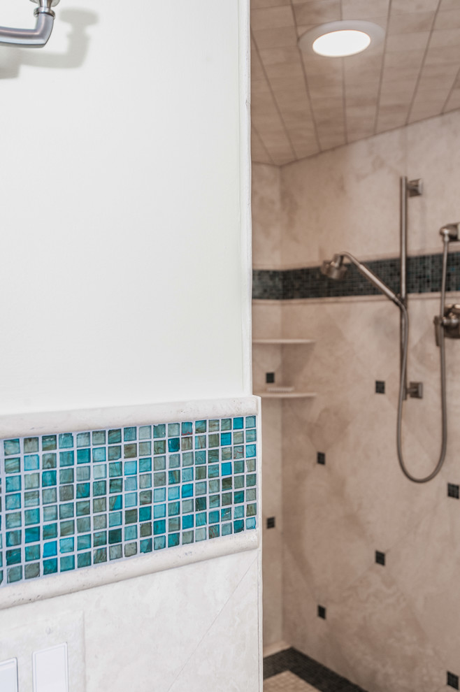 Inspiration for a large coastal master blue tile and mosaic tile mosaic tile floor bathroom remodel in Miami with shaker cabinets, light wood cabinets, a two-piece toilet, beige walls, an undermount sink and glass countertops