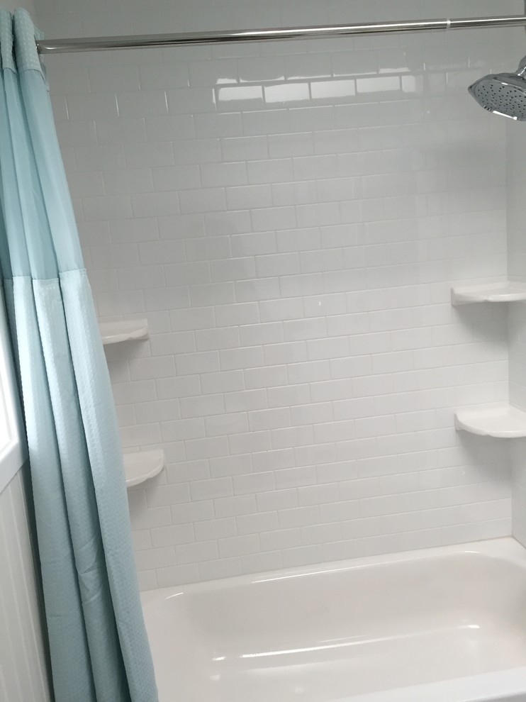 Bathroom - small traditional white tile and ceramic tile bathroom idea in Seattle