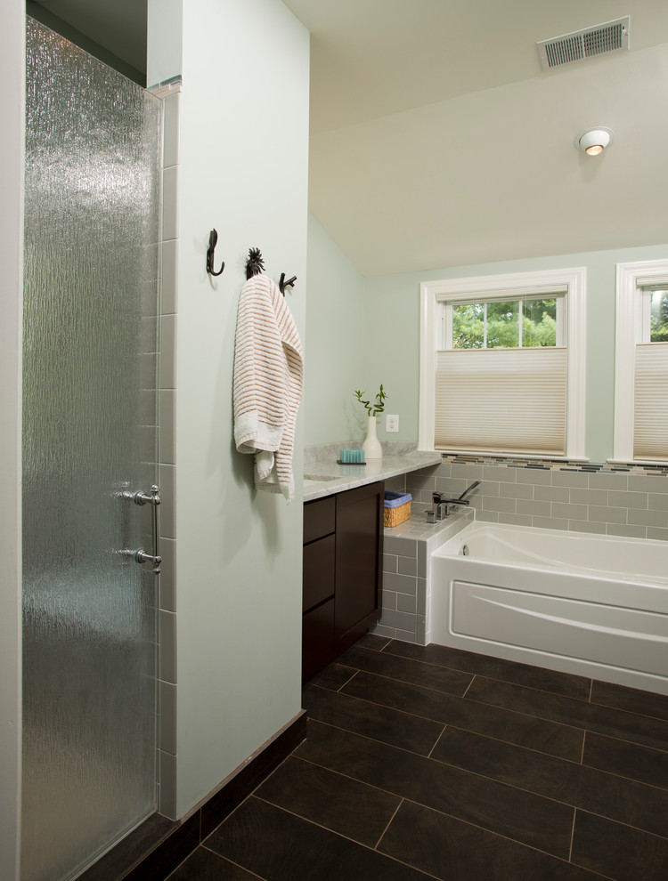 This is an example of a traditional ensuite bathroom in DC Metro with a submerged sink, flat-panel cabinets, dark wood cabinets, marble worktops, an alcove bath, an alcove shower, grey tiles, metro tiles, green walls and dark hardwood flooring.