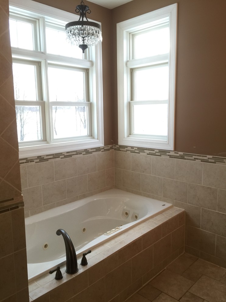 Example of a mid-sized classic master beige tile and porcelain tile porcelain tile doorless shower design in Other with an undermount sink, dark wood cabinets, quartz countertops, a two-piece toilet and orange walls