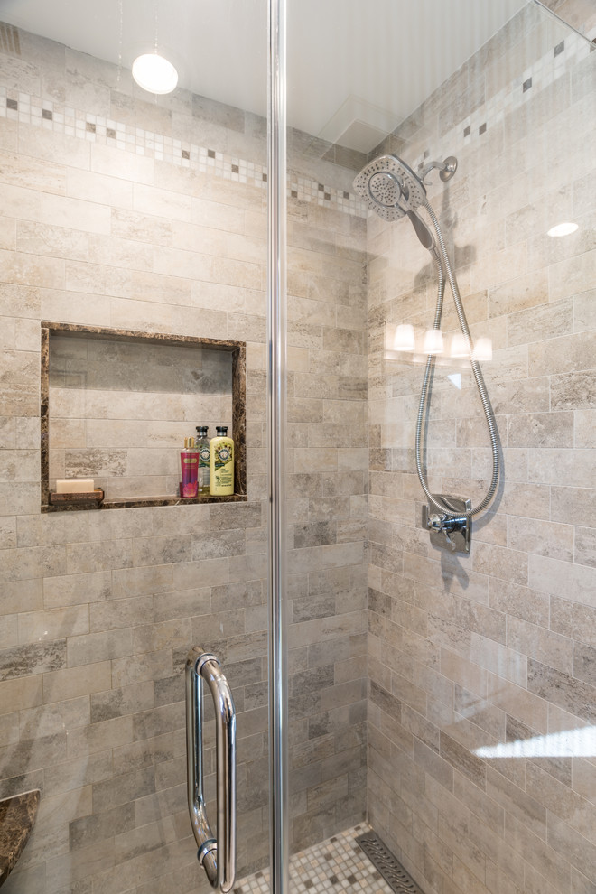 Inspiration for a mid-sized transitional kids' gray tile and cement tile ceramic tile and gray floor alcove shower remodel in New York with shaker cabinets, black cabinets, a two-piece toilet, beige walls, an undermount sink, granite countertops and a hinged shower door