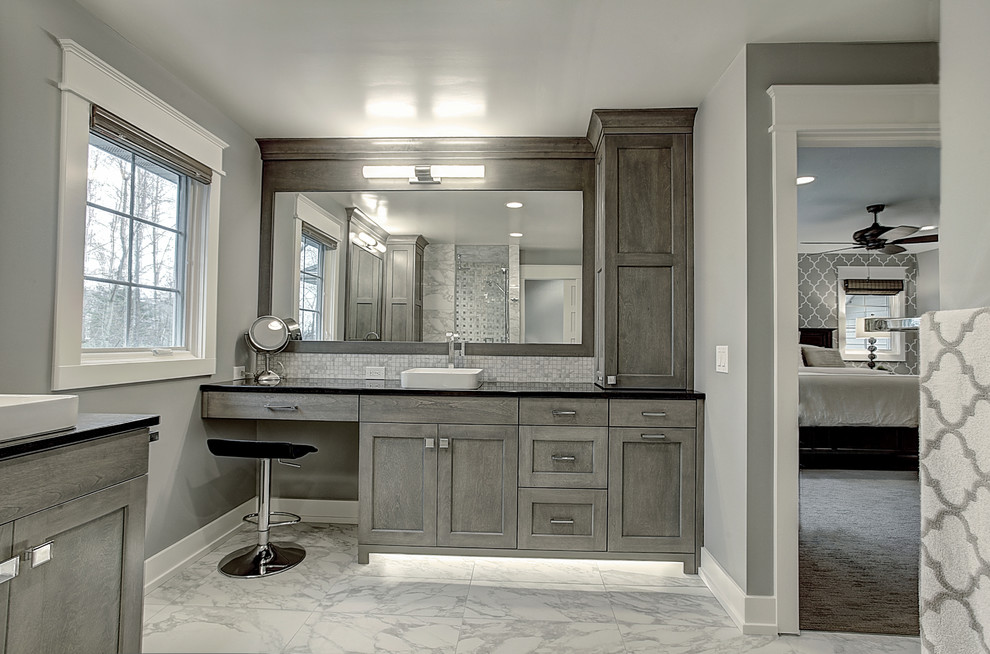 Inspiration for a traditional ensuite bathroom in Grand Rapids with a pedestal sink, freestanding cabinets, engineered stone worktops, an alcove shower, a one-piece toilet, grey walls, ceramic flooring and grey cabinets.