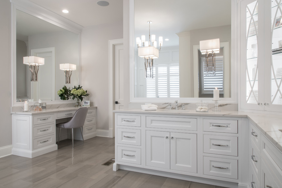 Design ideas for an expansive traditional ensuite bathroom in St Louis with beaded cabinets, white cabinets, a freestanding bath, a walk-in shower, a two-piece toilet, medium hardwood flooring, a submerged sink, engineered stone worktops, brown floors and white worktops.