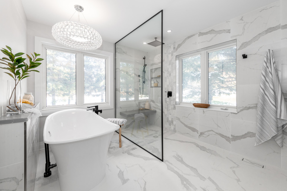 Example of a mid-sized farmhouse master gray tile and marble tile marble floor, gray floor and double-sink bathroom design in Ottawa with recessed-panel cabinets, gray cabinets, a two-piece toilet, gray walls, an undermount sink, quartz countertops, gray countertops and a built-in vanity