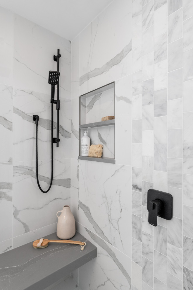 Bathroom - mid-sized farmhouse master gray tile and marble tile marble floor and gray floor bathroom idea in Ottawa with recessed-panel cabinets, gray cabinets, a two-piece toilet, gray walls, an undermount sink, quartz countertops and gray countertops