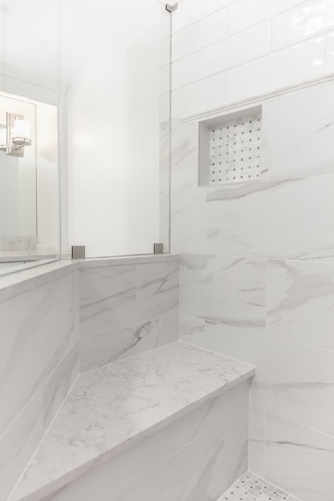 Inspiration for an expansive contemporary ensuite bathroom in Atlanta with recessed-panel cabinets, white cabinets, a freestanding bath, a two-piece toilet, white tiles, marble tiles, white walls, porcelain flooring, a submerged sink, engineered stone worktops and white floors.