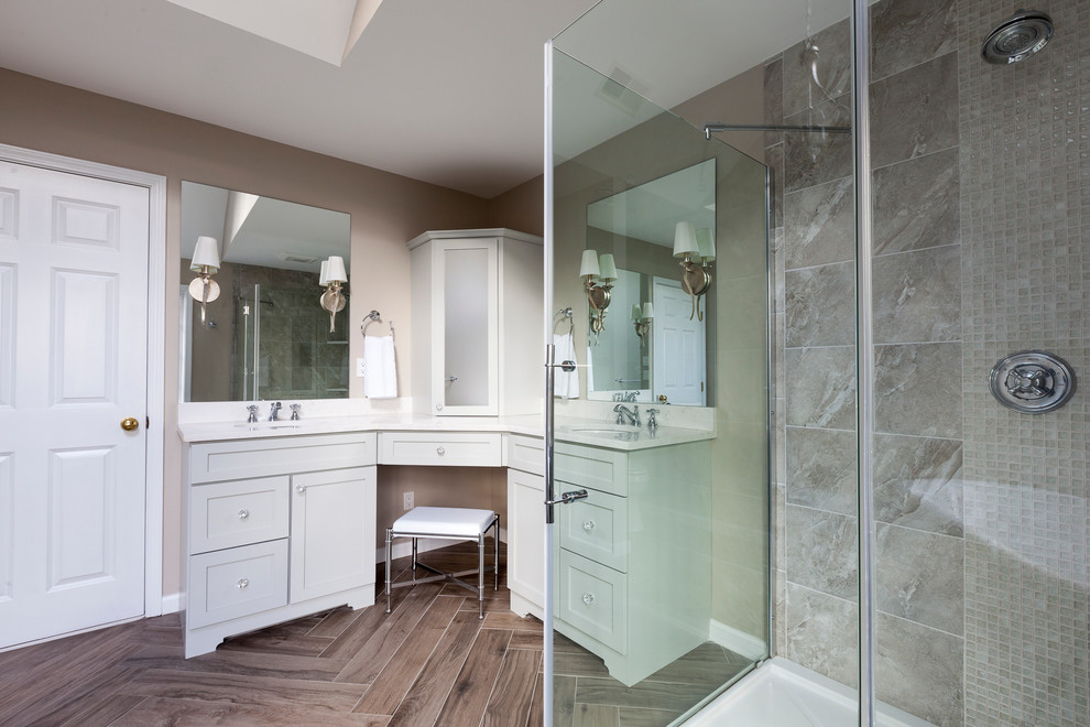 Inspiration for a mid-sized timeless master gray tile and porcelain tile porcelain tile bathroom remodel in Bridgeport with an undermount sink, recessed-panel cabinets, gray cabinets, quartz countertops, a two-piece toilet and gray walls
