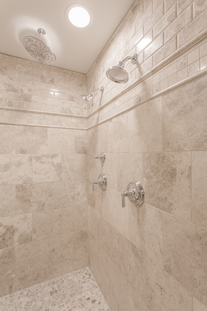 Example of a classic master gray tile and stone tile pebble tile floor alcove shower design in Jacksonville with white walls and quartz countertops