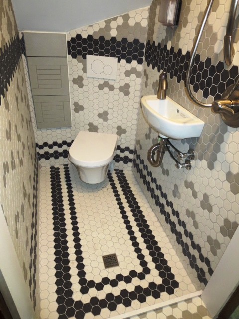 Design ideas for a small bohemian shower room bathroom in Columbus with grey cabinets, a walk-in shower, a wall mounted toilet, black and white tiles, porcelain tiles, multi-coloured walls, porcelain flooring and a wall-mounted sink.