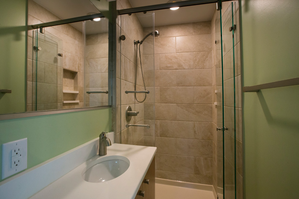 Small trendy master multicolored tile and porcelain tile porcelain tile and beige floor alcove shower photo in Raleigh with an undermount sink, flat-panel cabinets, medium tone wood cabinets, quartz countertops, green walls, a two-piece toilet, a hinged shower door and white countertops