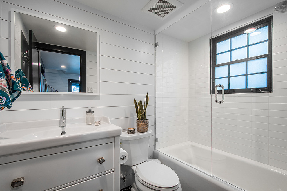 Example of an eclectic white tile alcove bathtub design in Salt Lake City with furniture-like cabinets and white cabinets