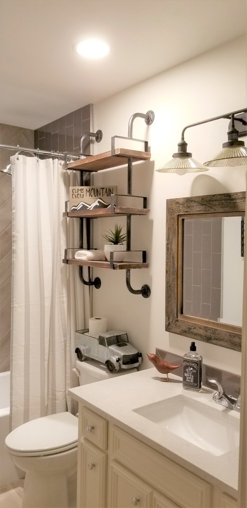 Inspiration for a small industrial family bathroom in Other with white cabinets, an alcove bath, a shower/bath combination, grey tiles, porcelain tiles, white walls, a submerged sink, quartz worktops, a shower curtain and white worktops.