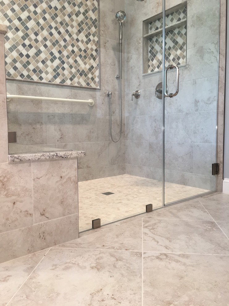 Corner shower - mid-sized traditional master beige tile and porcelain tile porcelain tile and beige floor corner shower idea in DC Metro with recessed-panel cabinets, dark wood cabinets, a two-piece toilet, gray walls, an undermount sink, granite countertops and a hinged shower door