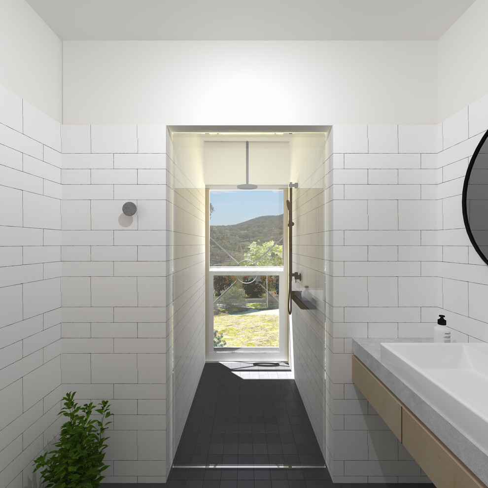 Inspiration för små moderna en-suite badrum, med öppna hyllor, skåp i ljust trä, en toalettstol med hel cisternkåpa, vit kakel, vita väggar, klinkergolv i porslin, ett fristående handfat, bänkskiva i betong, grått golv och dusch med gångjärnsdörr