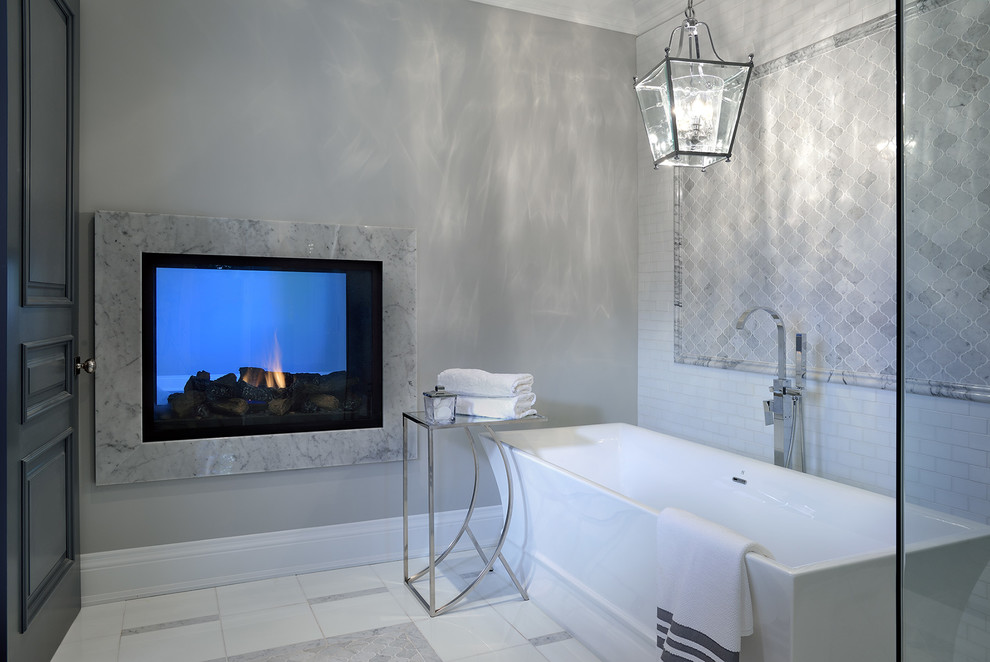 Large contemporary ensuite bathroom in Toronto with a freestanding bath, a corner shower, grey tiles, white tiles, ceramic tiles, grey walls and marble flooring.