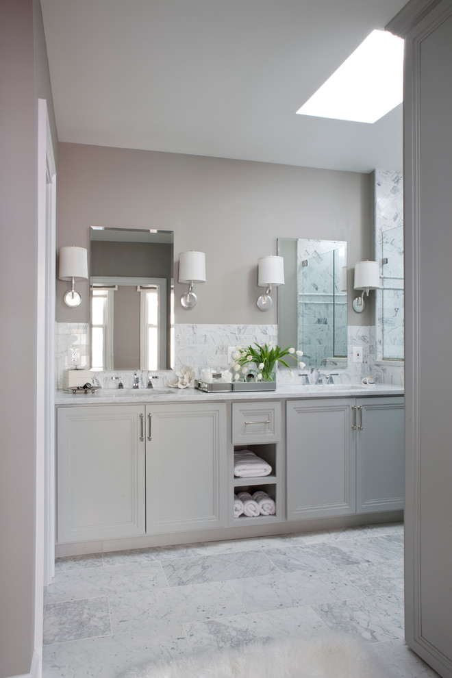 Transitional gray tile and stone tile bathroom photo in DC Metro with an undermount sink, recessed-panel cabinets, gray cabinets and marble countertops