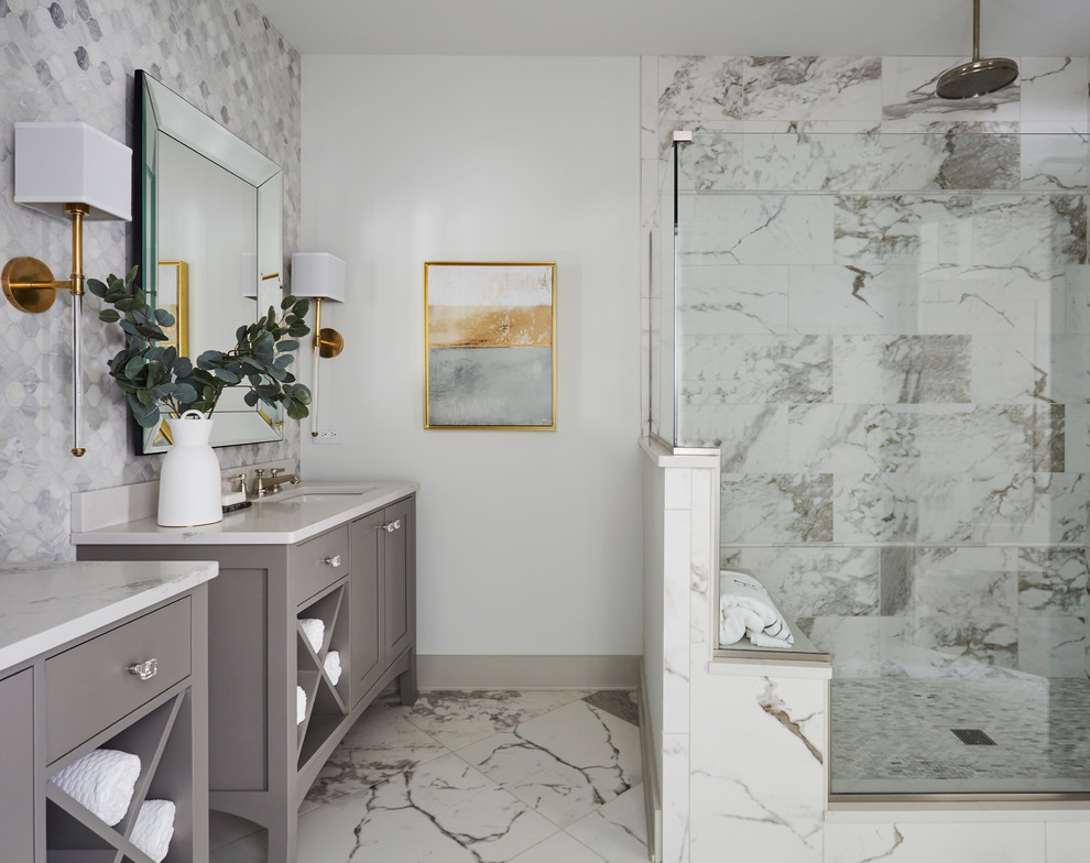 This is an example of a coastal ensuite bathroom in Chicago with grey cabinets, grey tiles, multi-coloured tiles, porcelain tiles, white walls, porcelain flooring, a submerged sink, engineered stone worktops, white worktops, multi-coloured floors and shaker cabinets.