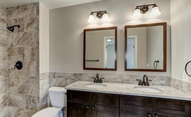 Inspiration for a mid-sized timeless master multicolored tile and stone tile alcove shower remodel in DC Metro with shaker cabinets, dark wood cabinets, a two-piece toilet, multicolored walls, an undermount sink and wood countertops