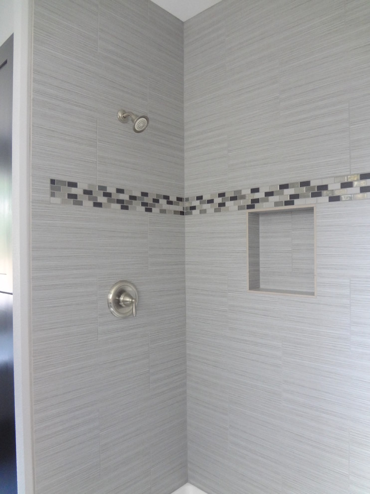 Example of a mid-sized classic master gray tile and mosaic tile ceramic tile bathroom design in Portland with shaker cabinets, dark wood cabinets, a two-piece toilet, gray walls, an undermount sink and granite countertops